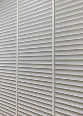 Fototapeta premium Wooden shutters blind on the window in the living room
