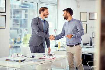 Young businessman successfully completed business meeting with clients.