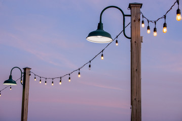 Obraz premium String of harbor lights at waterside dock