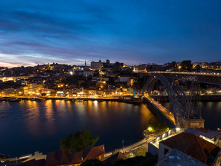Fototapeta premium Ribeira district - historic center of Porto with Douro river and Porto cathedral in night (Porto, Portugal, Popular travel destination in Europe)