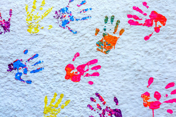 handprints paint on a white wall