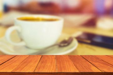 Wood table top on blur coffee background