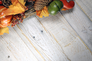 Fall Leaves and Decorations against Distressed wood surface