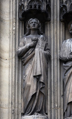 Saint John the Apostle, statue on the portal of the Saint Laurent Church, Paris, France