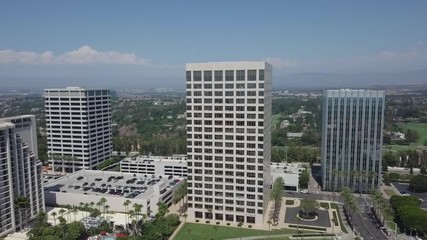 Newport Beach Fashion Island Business Towers Aerial Dolly Rotation Reveal Golf Course Behind High Rise Properties. - Powered by Adobe