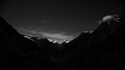 black sunset in mountains