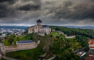 Fototapeta na wymiar Aerial panorama view of medieval newly restored Trencin castle over the Vah river in Slovakia with dramatic sky