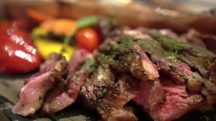 Beef steak medium rare cut serve on slate plate