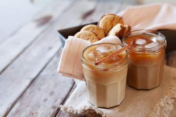 Iced coffee in glasses with cream and ice