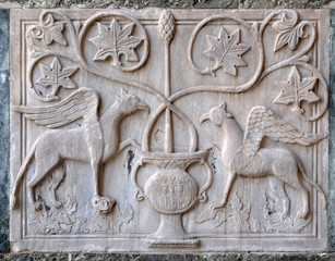 Byzantine relief of two griffins, facade detail of St. Mark's Basilica, St. Mark's Square, Venice, Italy