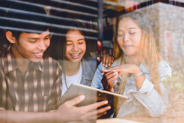 Portrait of cheerful young friends in Cafe Multiracial happy young people laughing enjoying meal having fun sitting together.