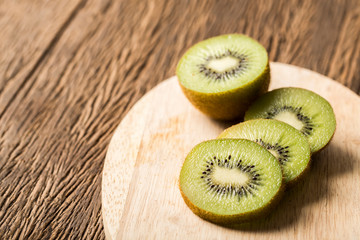 Kiwi fruit on wooden table clsoe up.