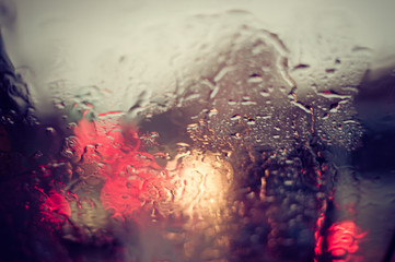 Water rain on car window. vintage filter