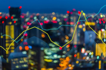 Trading stock exchange graph on blur city background