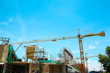 Fototapeta na wymiar Crane and blue sky in construction site