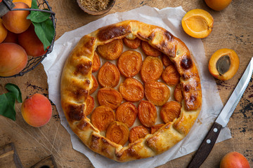 apricot galette on wooden background