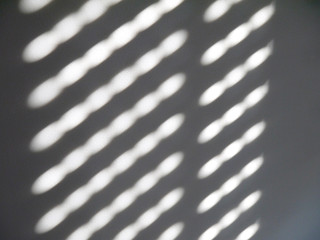 Sun glare on a white wall.