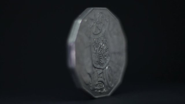 Rotating Australian Coin On Black Background. Coat Of Arms