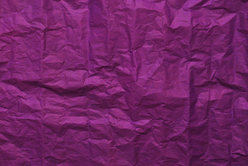 Purple crumpled paper texture background. Top view