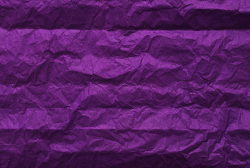 Purple crumpled paper texture background. Top view