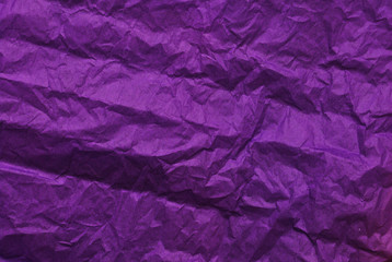 Purple crumpled paper texture background. Top view