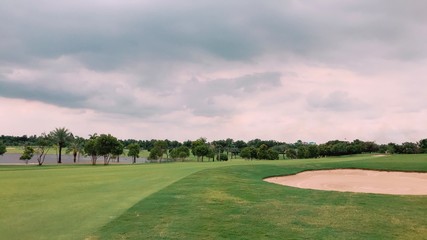 golf course on background of blue sky by soft focus