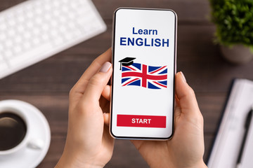 Language Educational App On Smartphone In Woman's Hands