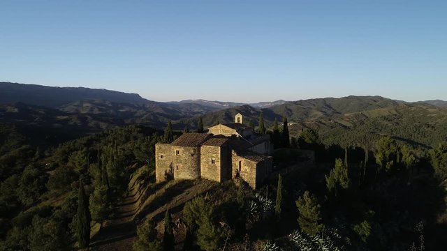 4K drone footage of small romanic hermitage of the 16th century in Gratallops,  a small town of Catalonia, at sunset
