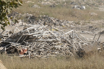 Kiev, Ukraine, Europe - September 2019: Landfill of building materials. Ecology, environmental pollution. Landfill waste. Garbage in the woods.