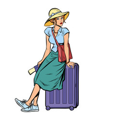 woman tourist sitting on a travel suitcase