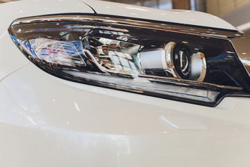 Detail of a beauty and fast car with headlight.