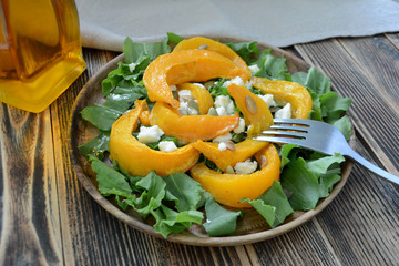 Warm autumn pumpkin salad with seeds and soft cheese Healthy food concept