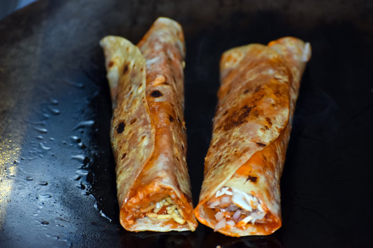 A street food vendor prepares Paneer Butter frankie in Mumbai,India