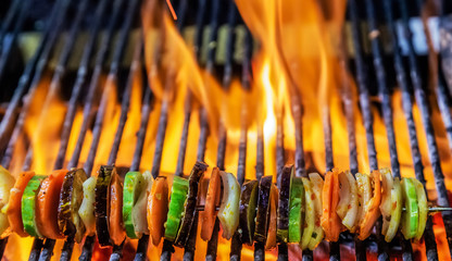 Fototapeta premium Kebabs mixed vegetables skewers Cooking grilling on flaming grill steamed
