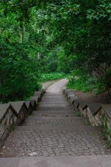 Walk on a warm sunny day in the park Volkspark Friedrichshain in Berlin, stone stairs