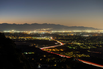 Los Angeles California dawn view of the 118 freeway in the San Fernando Valley.  Burbank, North Hollywood and the San Gabriel Mountains are in background.  