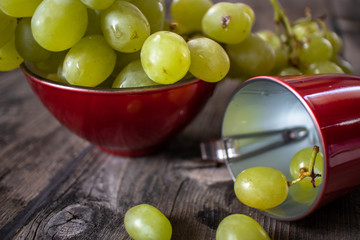 Fresh organic white grape on old wooden table