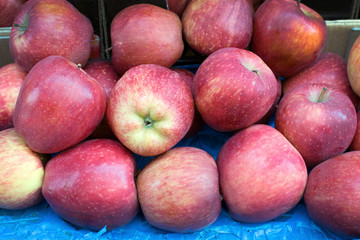 beautiful red apples are on the table, top view, background, benefits and harm of apples, properties, diet, vegetarianism.