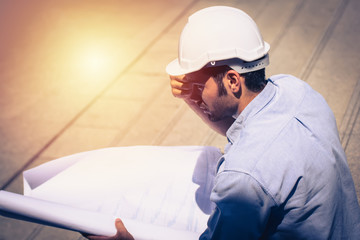 civil engineer working with documents at construction site.engineers working at building site. 