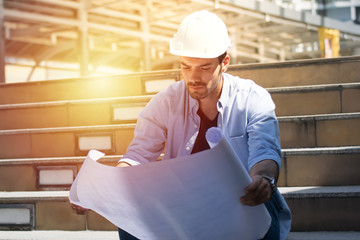 civil engineer working with documents at construction site.engineers working at building site. 