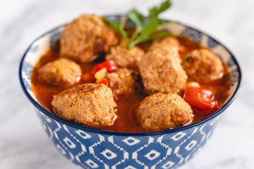 Pork and beef meatballs in tomato and paprika sauce