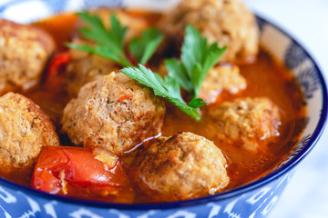 Pork and beef meatballs in tomato and paprika sauce