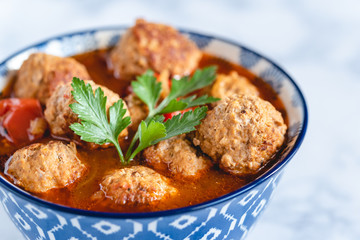 Pork and beef meatballs in tomato and paprika sauce