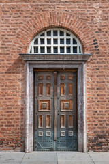 Old door and red brick wall