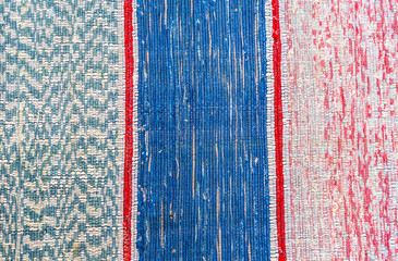 Texture of a homemade rug from different fabrics