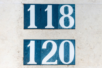 Street number sign on the wall