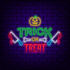 Trick or treat. Neon sign on dark brick background.