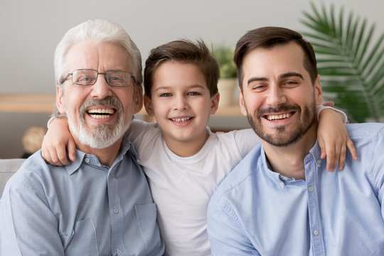 Happy male intergenerational 3 three generation men family portrait