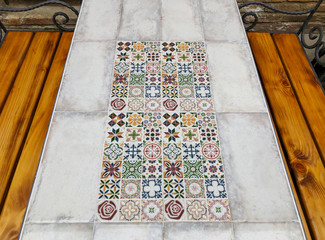 TBILISI, GEORGIA - Murch 29 2019: The  cafe in the old Tbilisi, table with ornaments. The restored area of old Tbilisi. Tourism in Georgia, tourist area