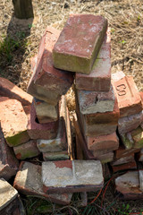 A pile of weathered bricks in the sun